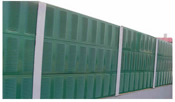 Green perforated louvers are installed on the side of the highway.