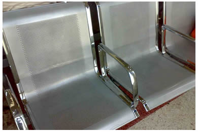 Two chairs are made of aluminum perforated screen and the arms of the chair is made of galvanized plate.