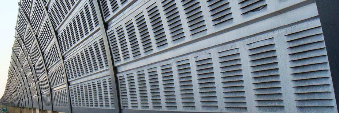 Perforated louvers are installed on the side of the highway.