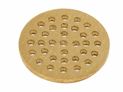 There is a brass perforated filter disc with round holes.